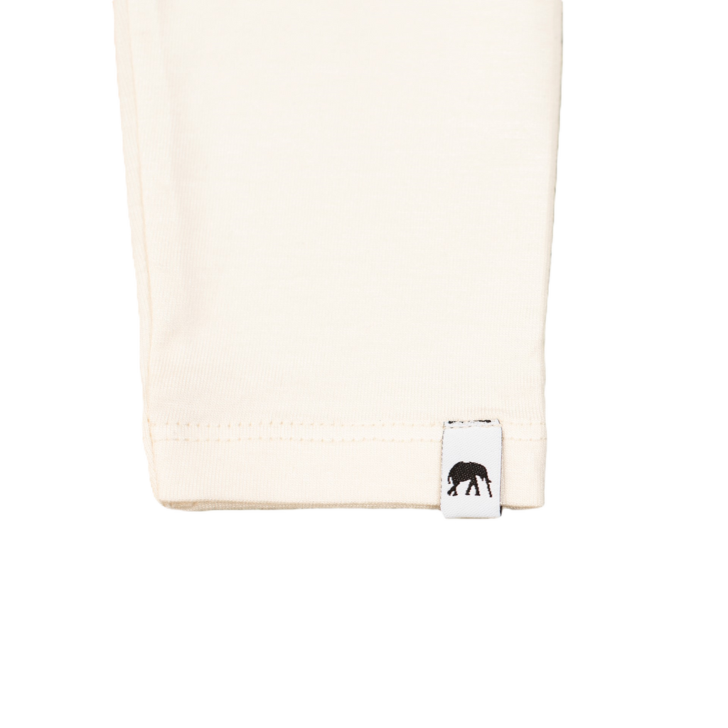 Beige towel with a small black logo on a white background