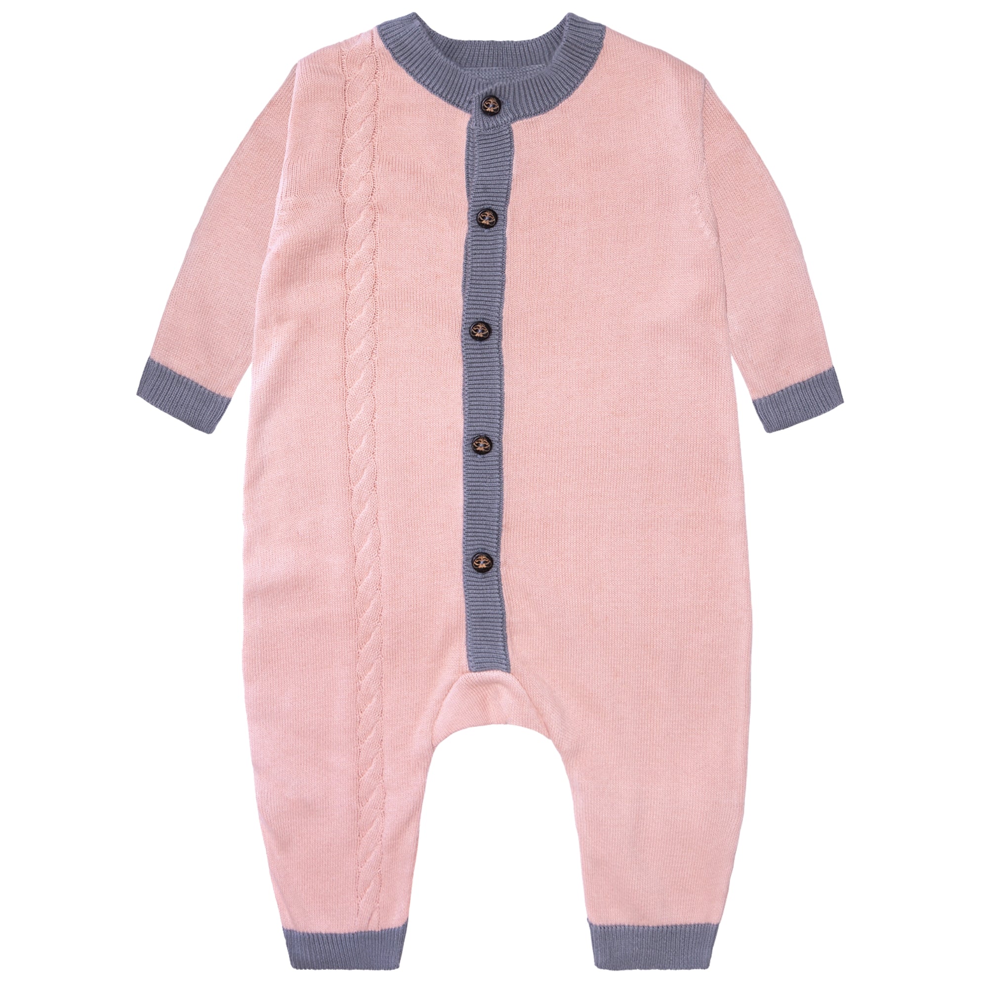 Newborn baby sleeping in a pink outfit on a white fluffy blanket
