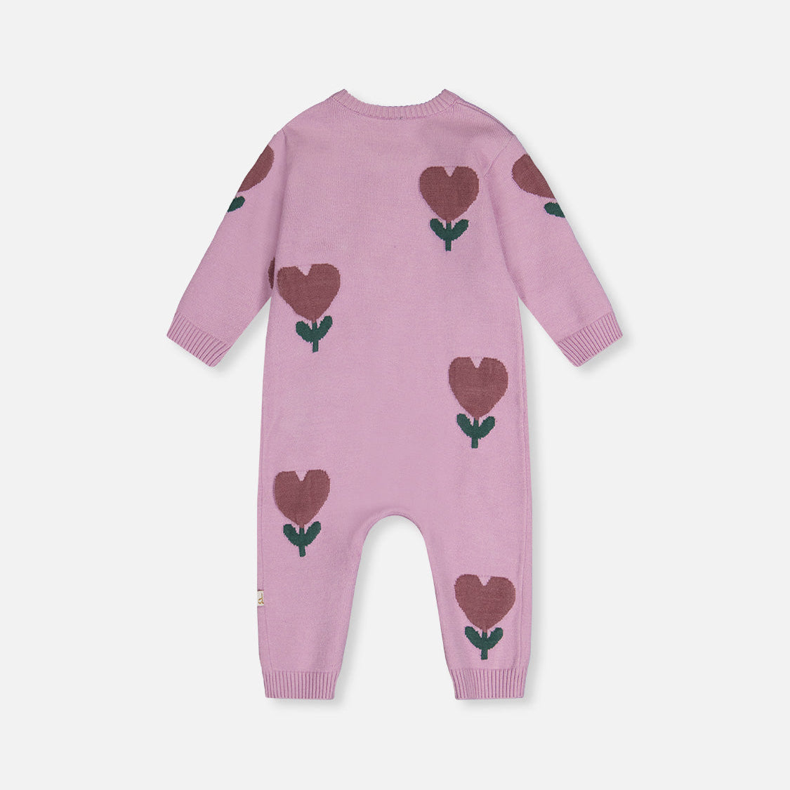 Pink baby onesie with heart patterns on a white background